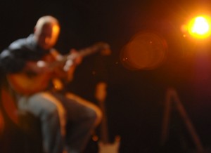 Steve Krenz playing guitar on stage