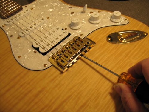 adjusting the nut on a guitar