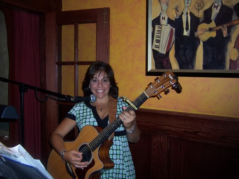 Maria with acoustic guitar