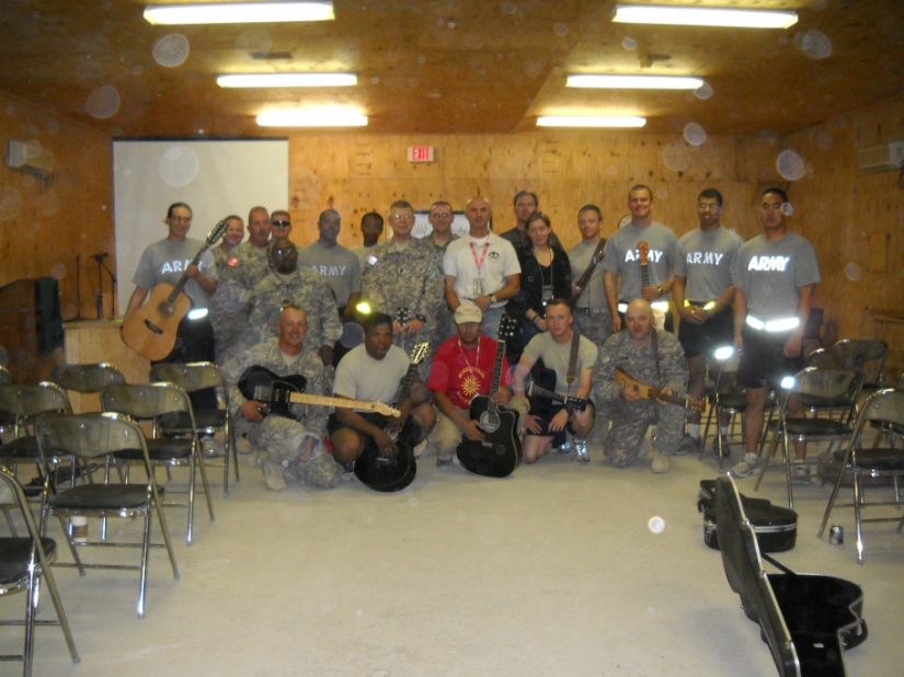 troops at a guitar lesson