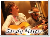 Sandy Mason Playing Guitar